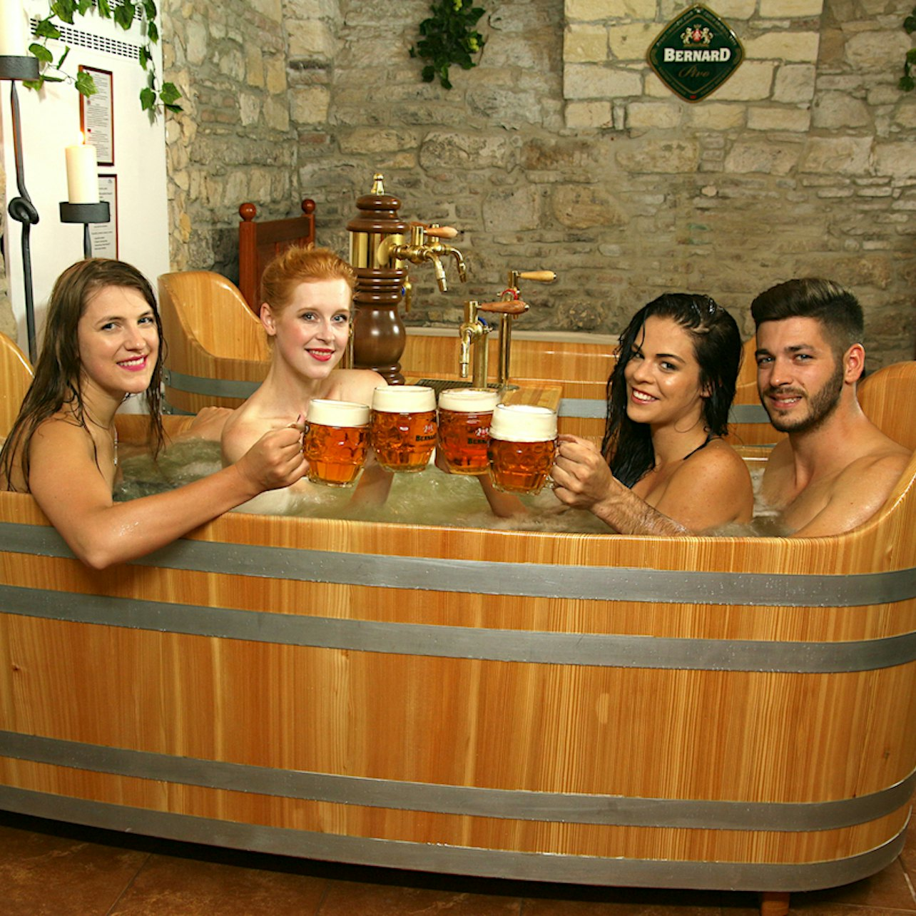 Relax in a warm bubbling beer bath with friends enjoying the soothing benefits of Bernard beer while sipping unlimited brews. A unique wellness escape in the heart of Prague!